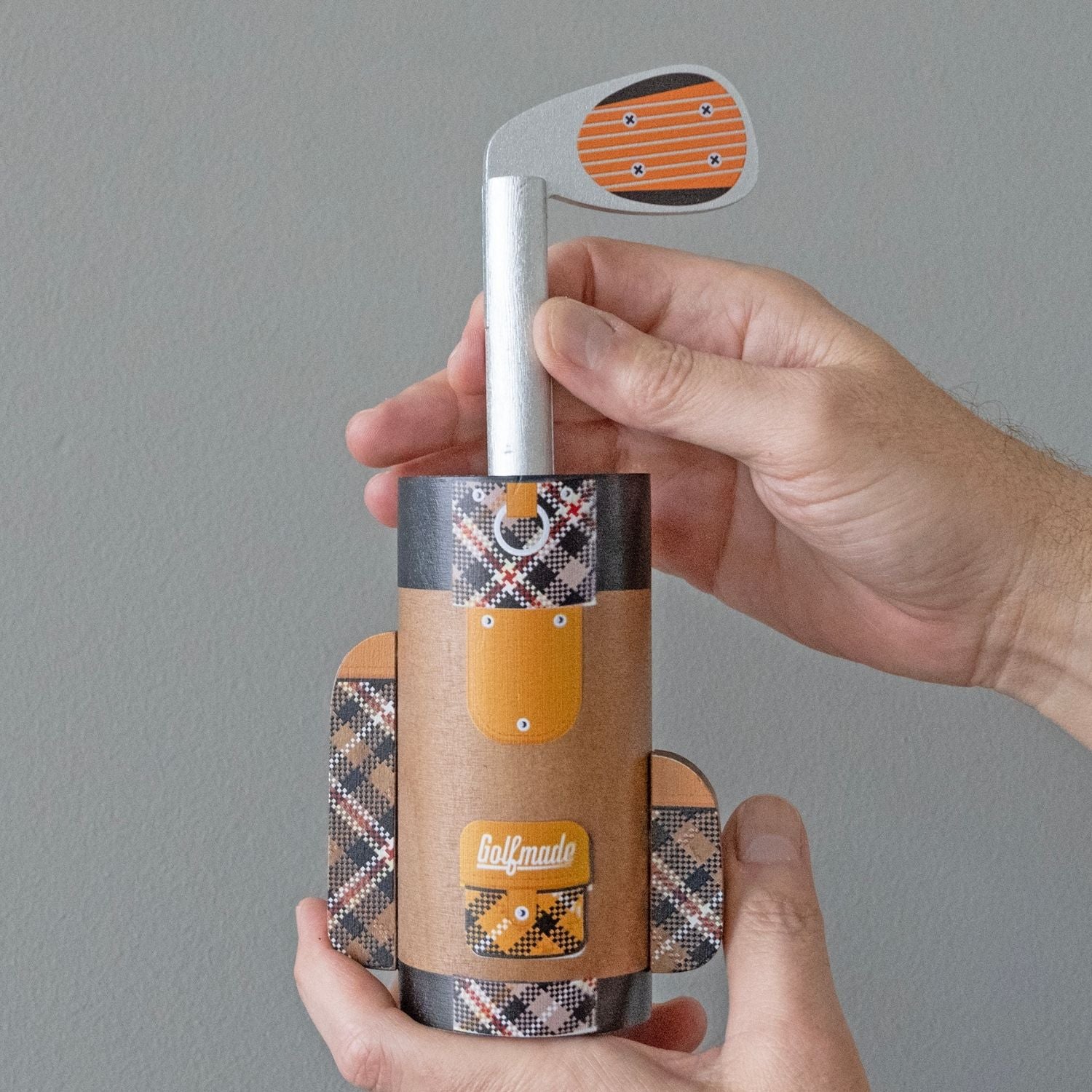 Project Genius Golf Bag Puzzle metal brain teaser featuring a golf club that must be twisted through a hidden maze inside a golf bag